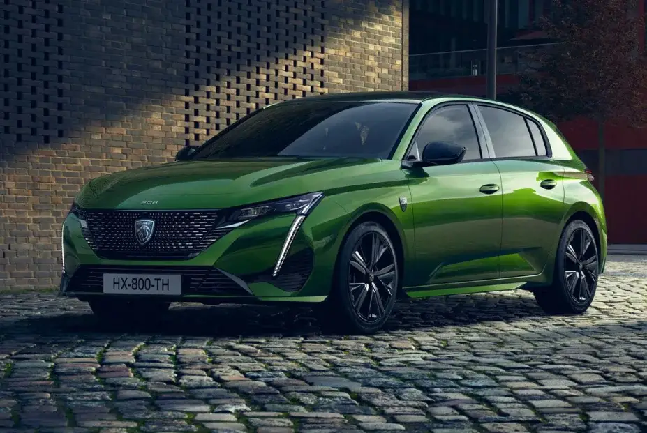 green peugeot e-308 front side